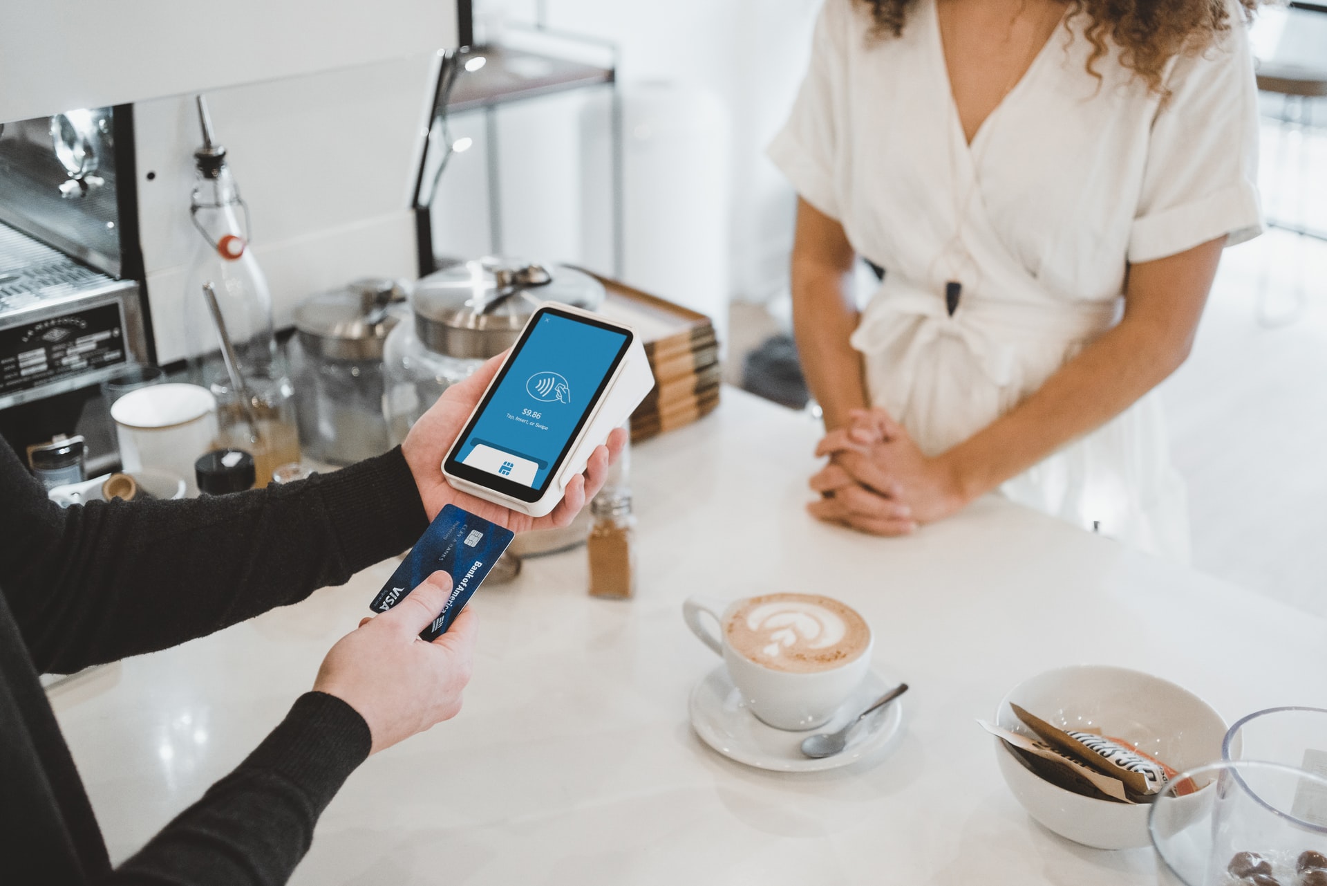 credit card being used at a coffee shop