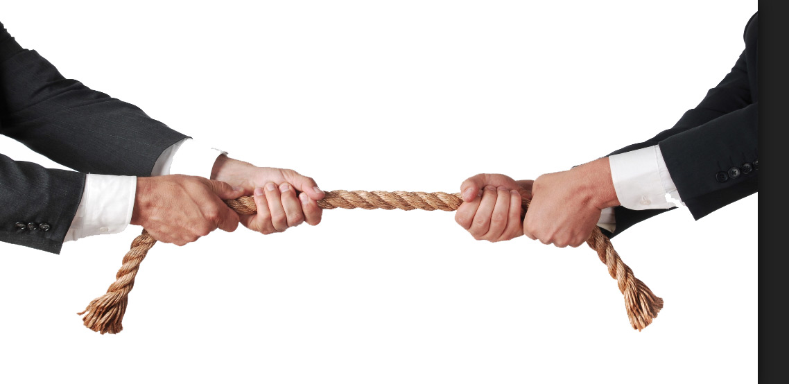 Businessmen playing Tug-of-War