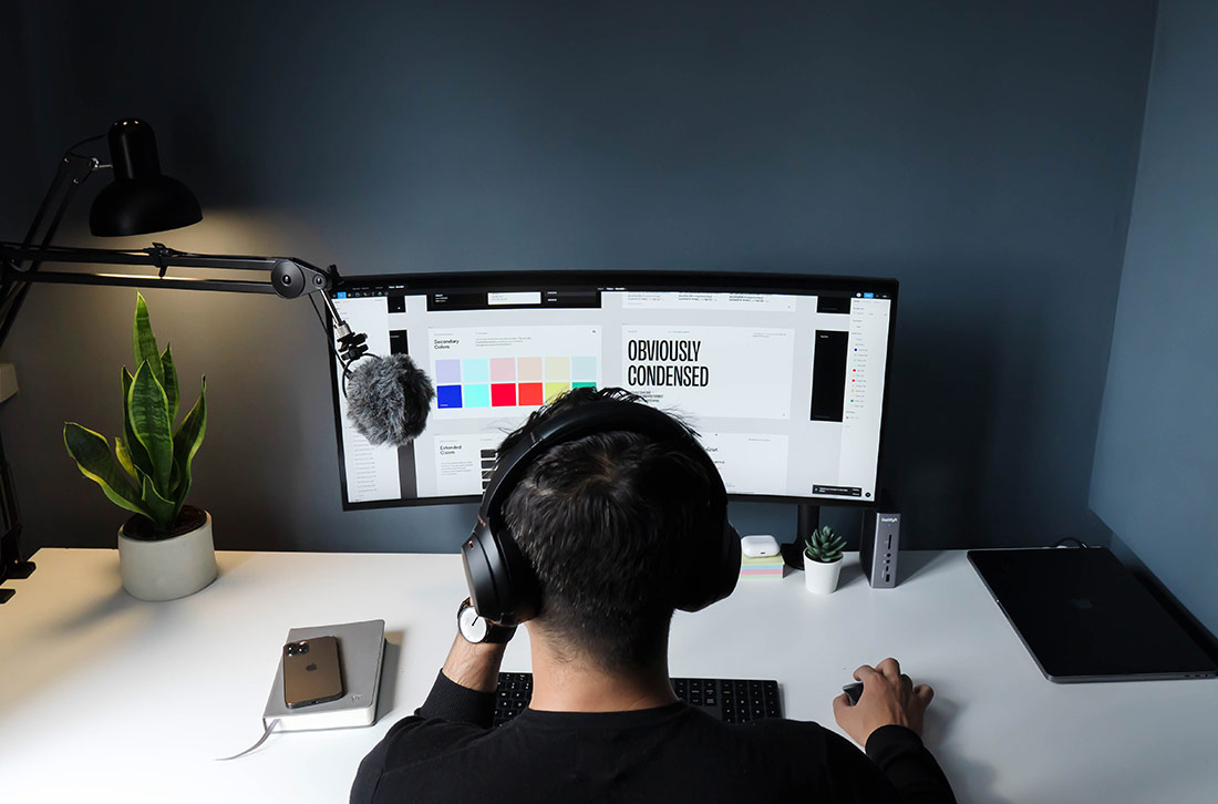 Freelancer with Microphone and Computer